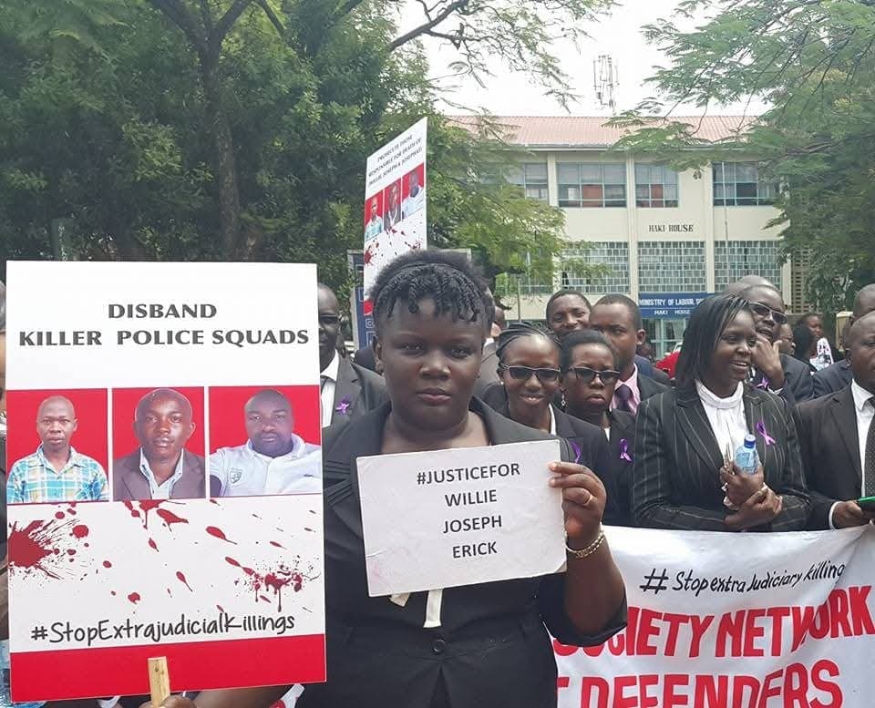Jacqueline Ingutiah holding a placard at the advocates' march against extrajudicial killings