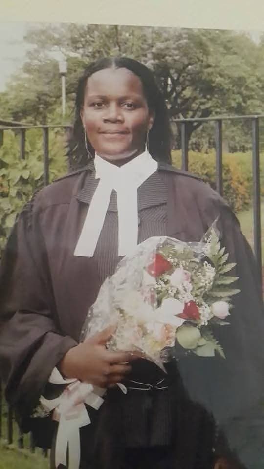 Jacqueline Ingutiah in her advocate's gown and bands, holding a bouquet, on her admission to the Bar