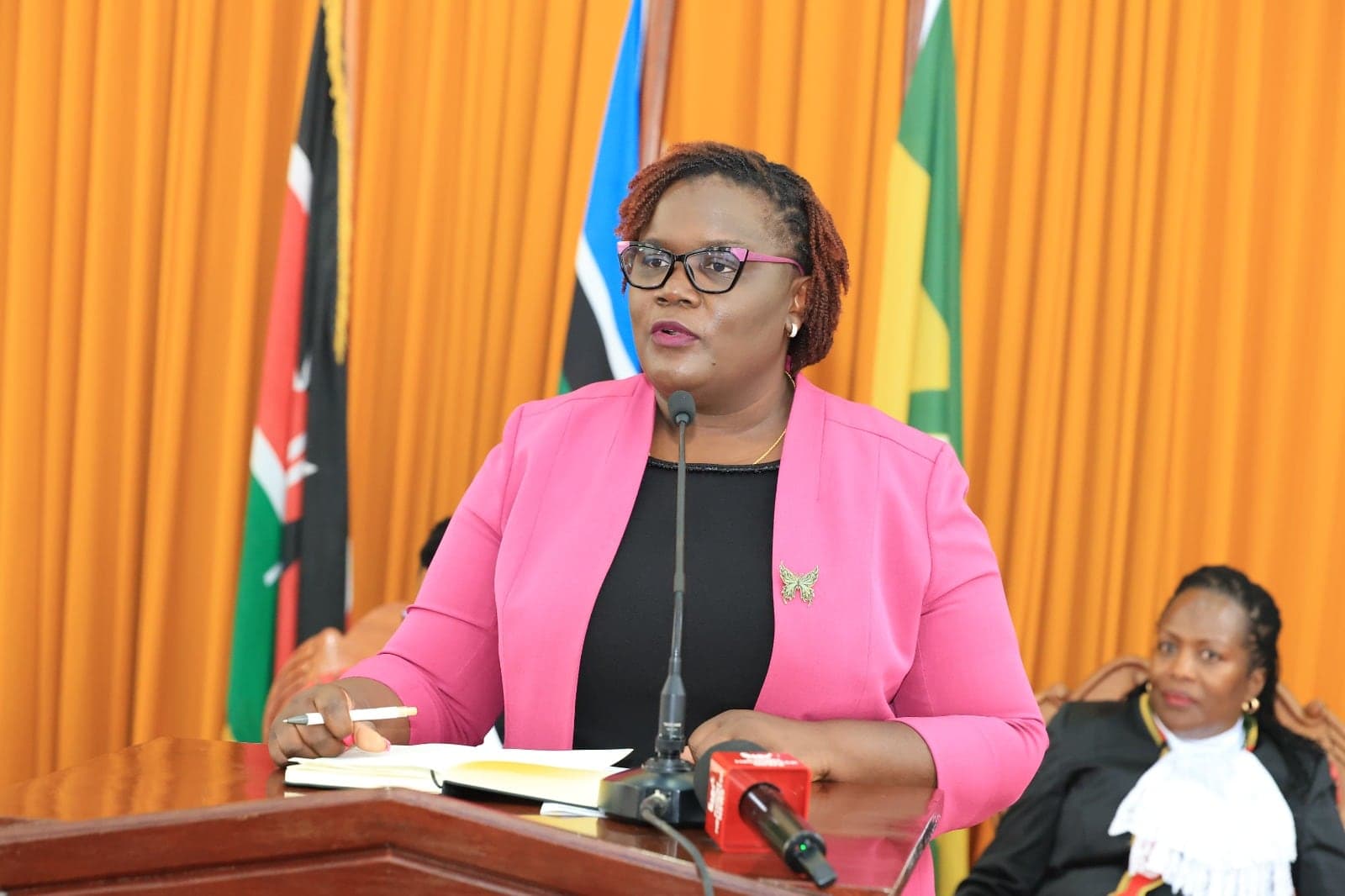 Jacqueline Ingutiah addressing a Judiciary event from the podium