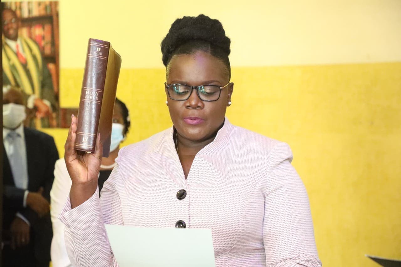 Jacqueline Ingutiah holding a Bible as she takes the oath of office
